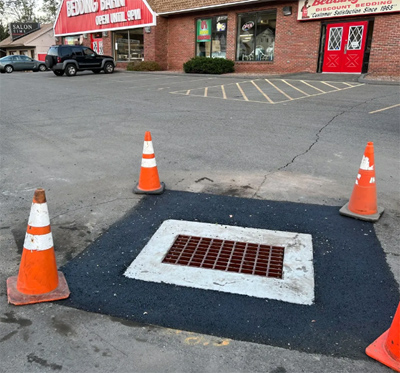 Installation of concrete catch basin with asphalt perimeter, MA, CT